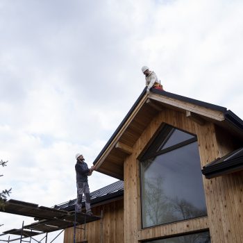 long-shot-men-working-roof-together